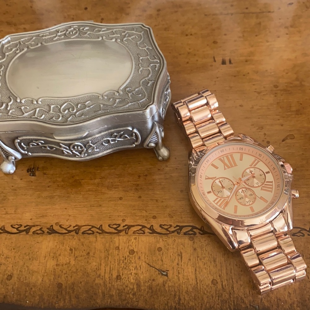Rose Gold watch with Roman numerals